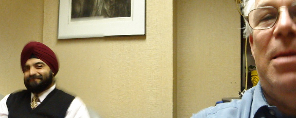 Two people sitting in an office.