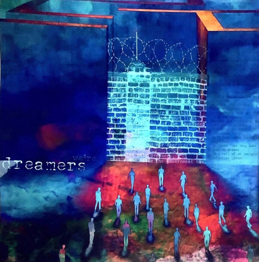 People walking towards a barbed wire wall.